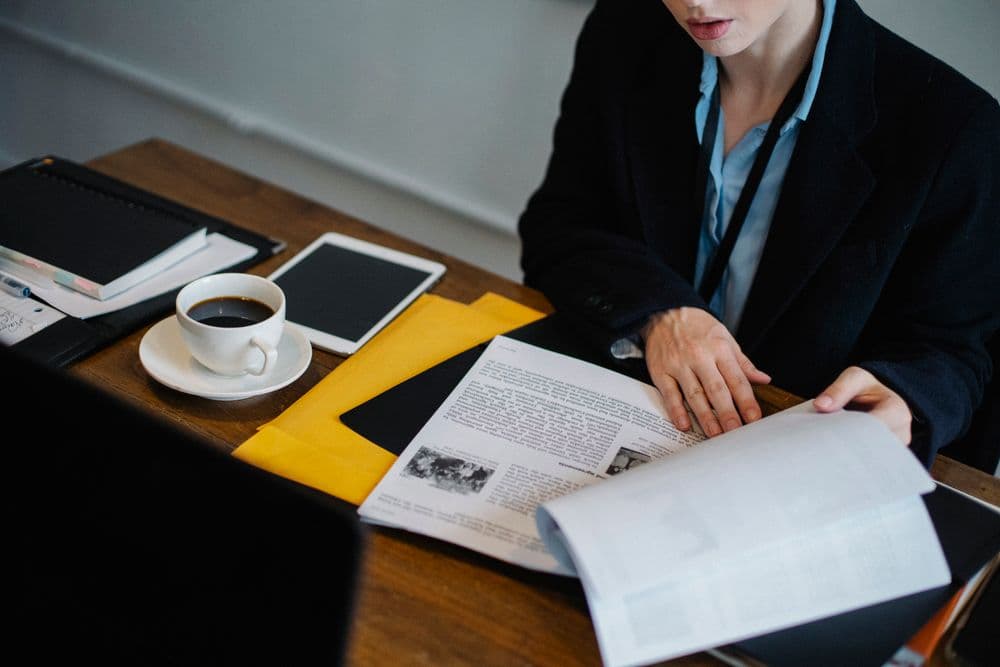 A professional comparing family dispute resolution training options at their desk.